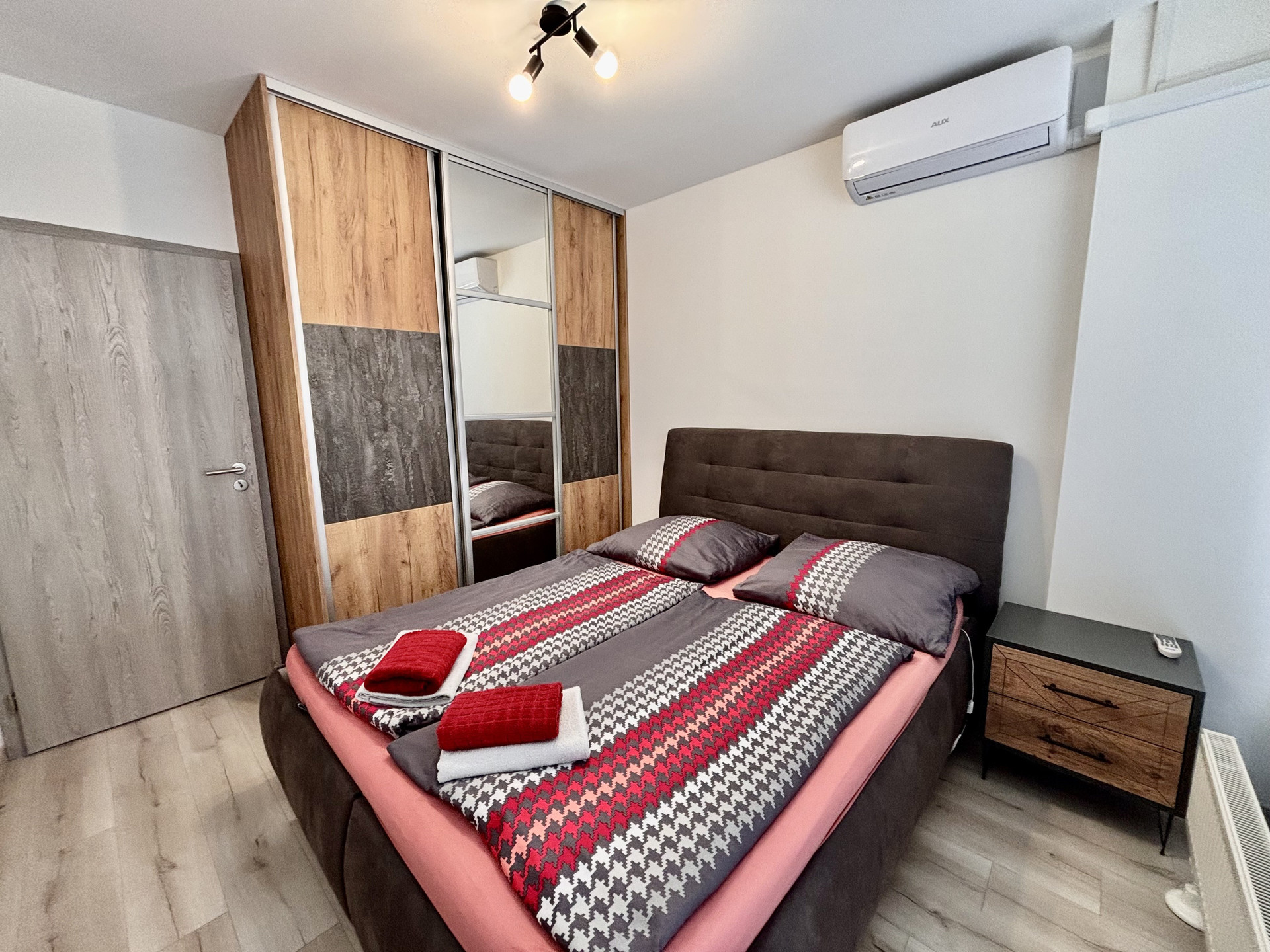 Bedroom with wardrobe and bed