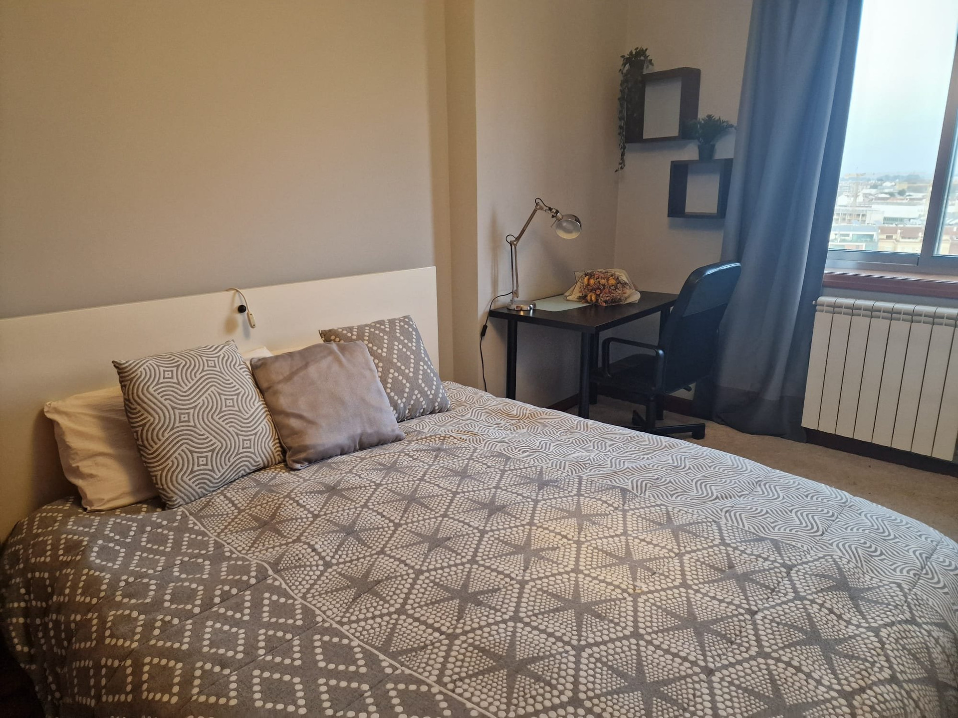 Bedroom with desk and shelves