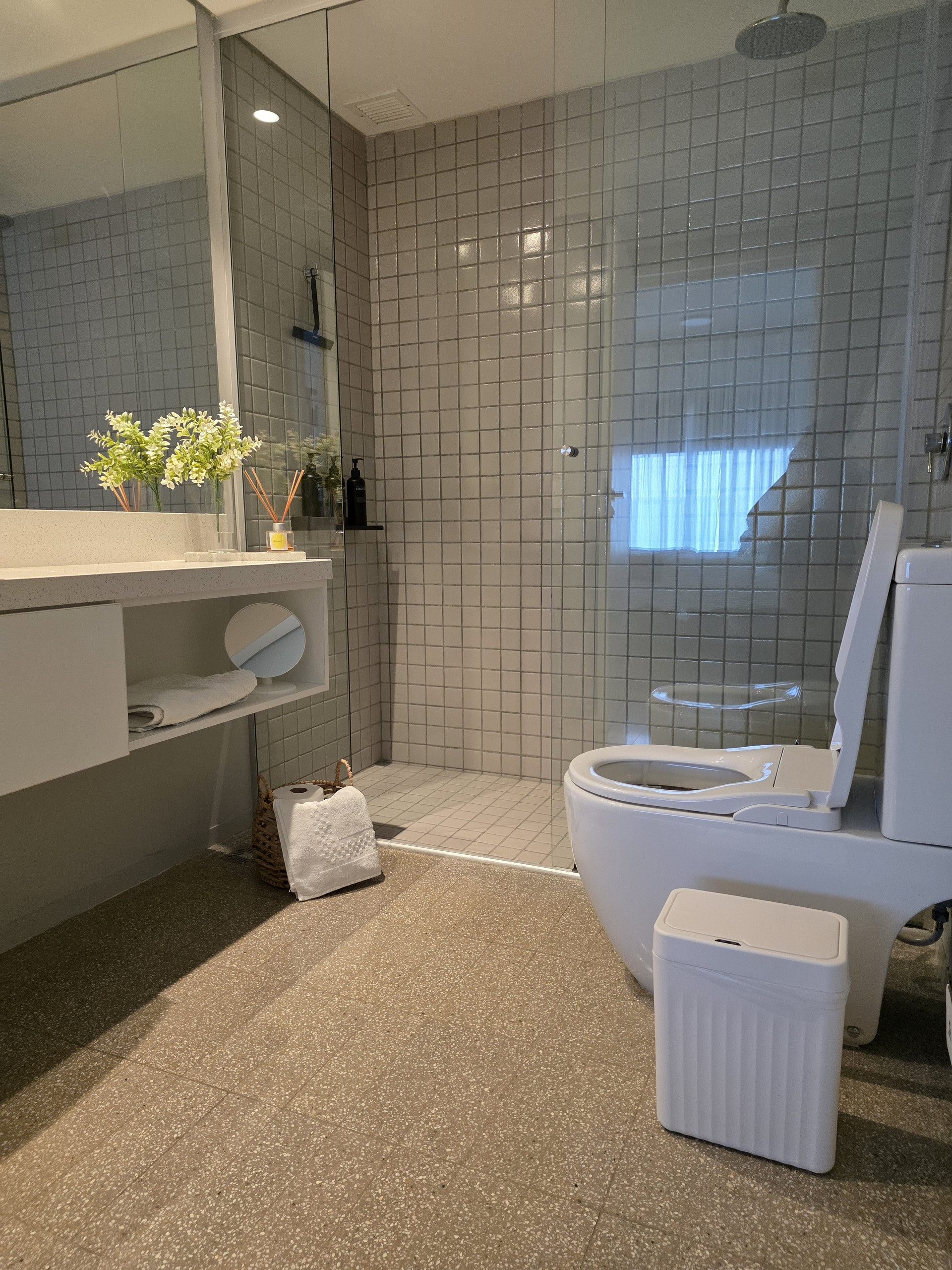 Bathroom with tiled shower and toilet