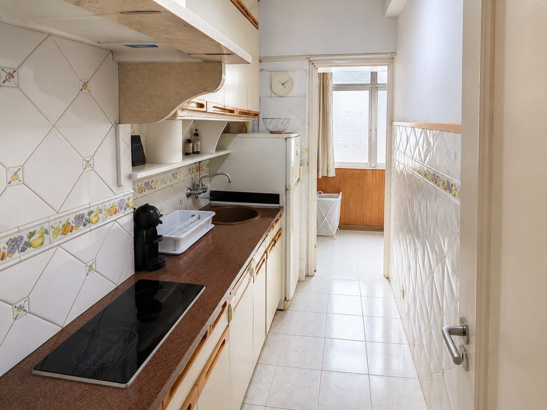 Galley kitchen with ceramic hob