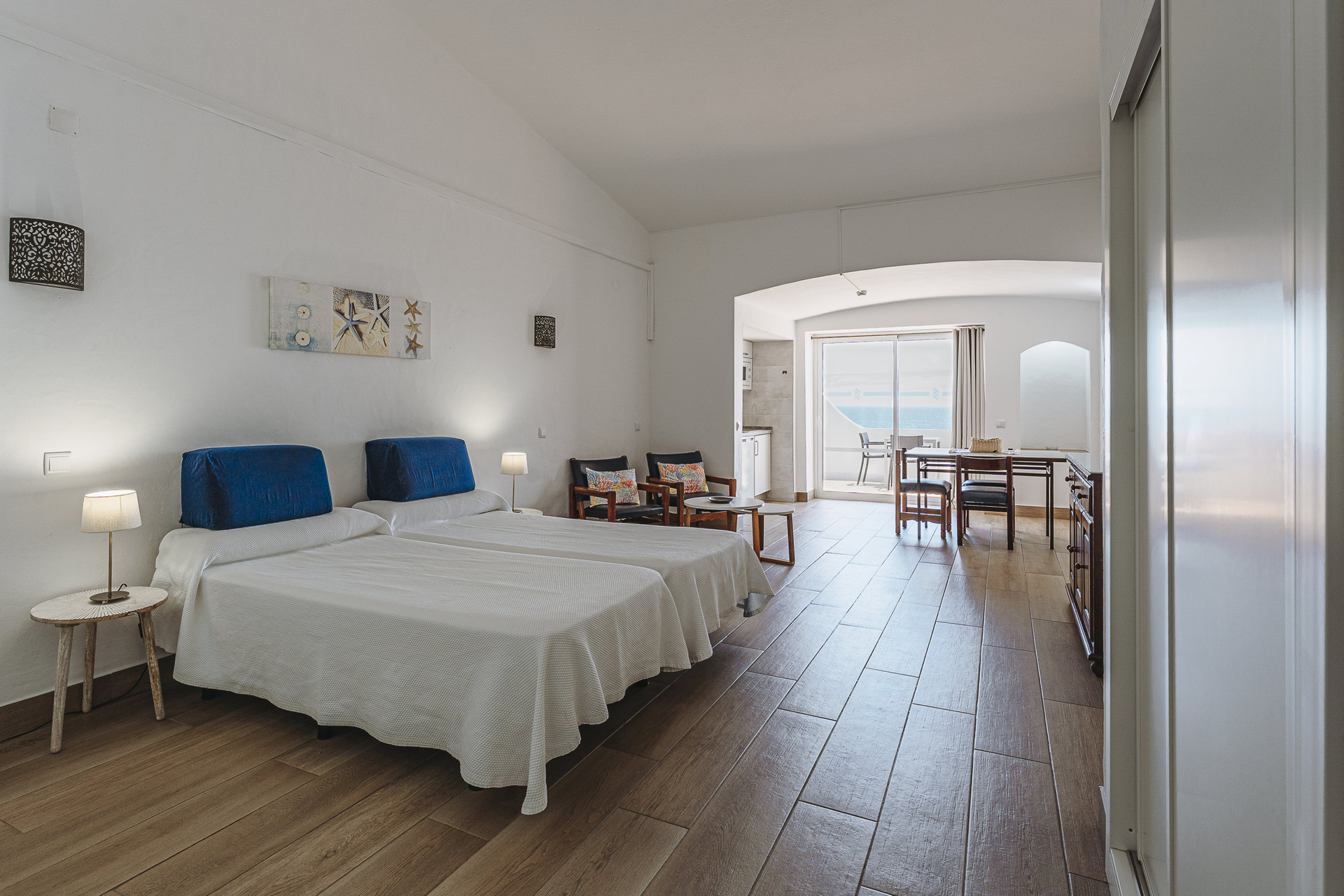 Bedroom with living area beyond