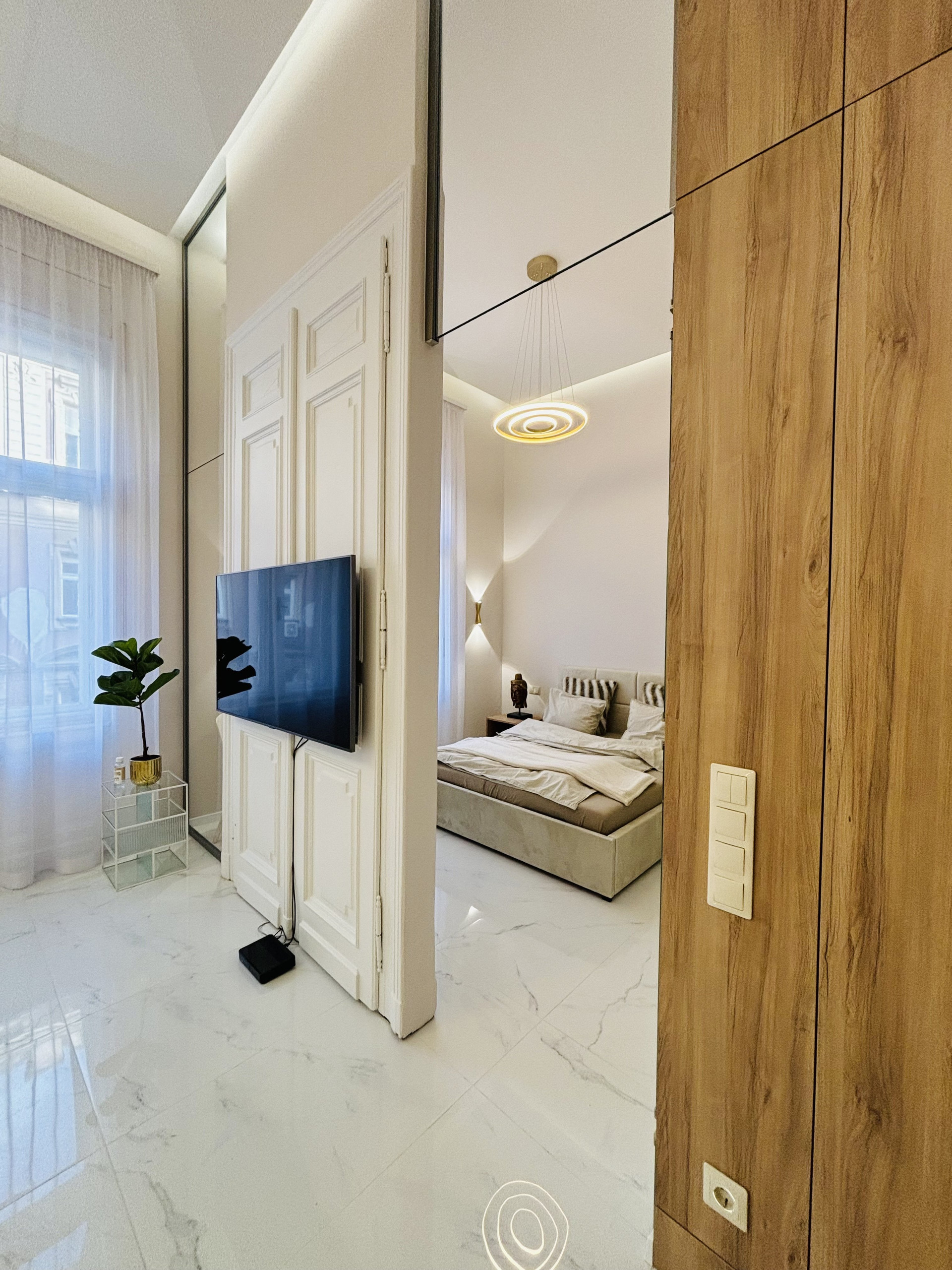 Living area with TV and bedroom
