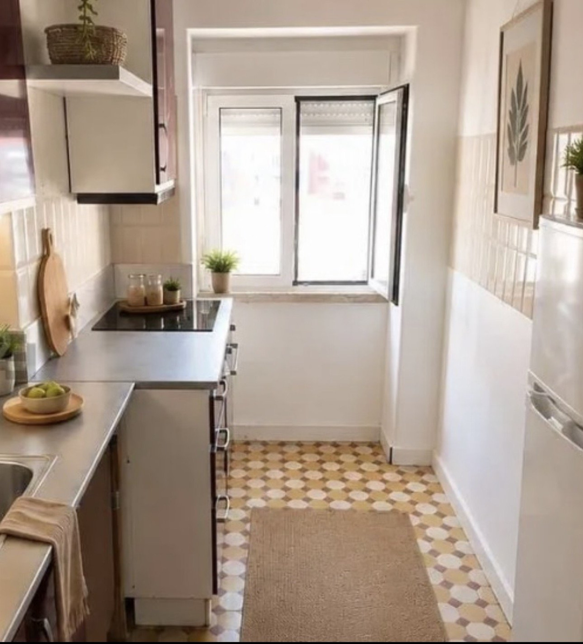 Compact kitchen with patterned tile floor