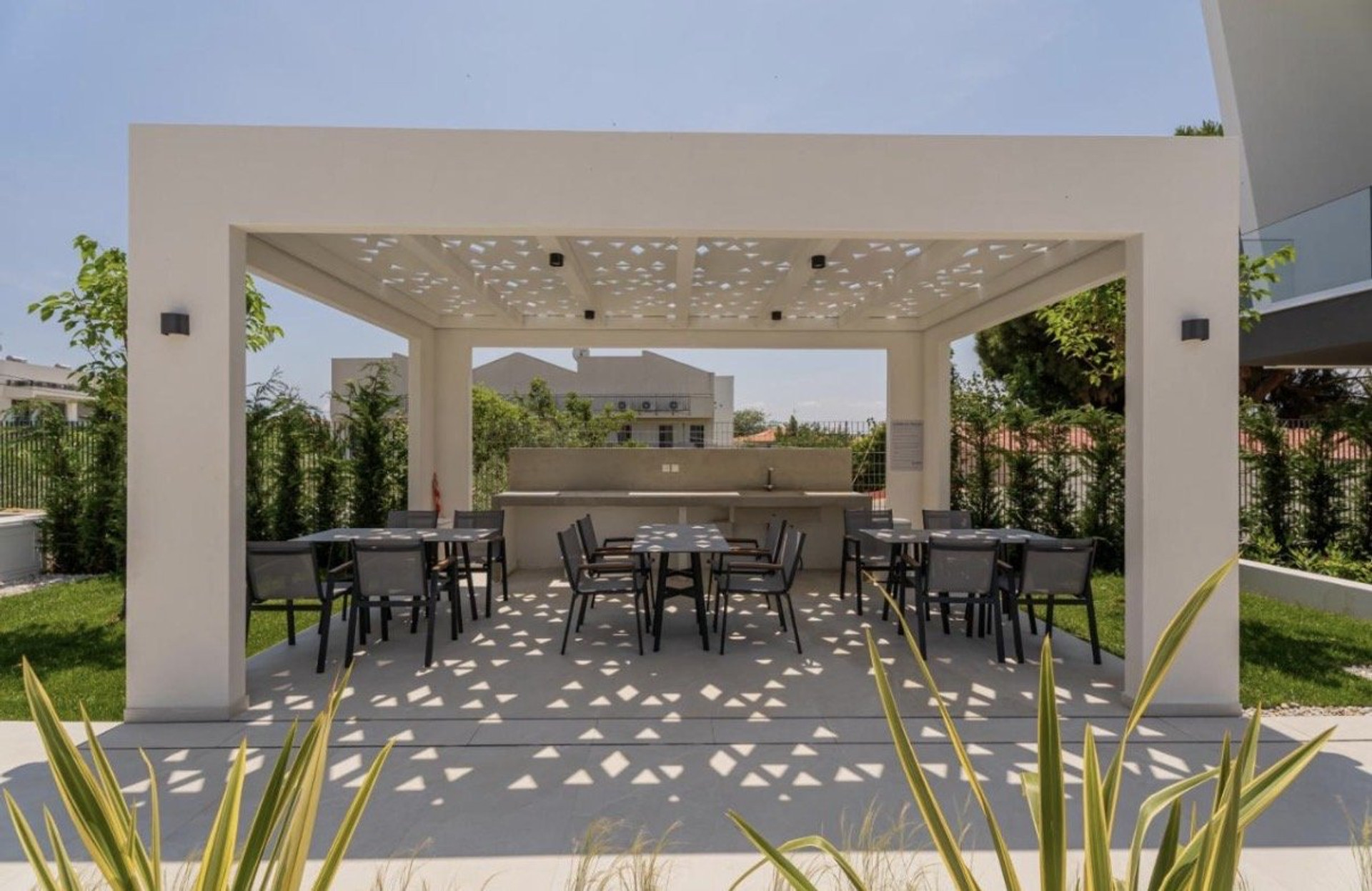 Outdoor pergola dining and BBQ area