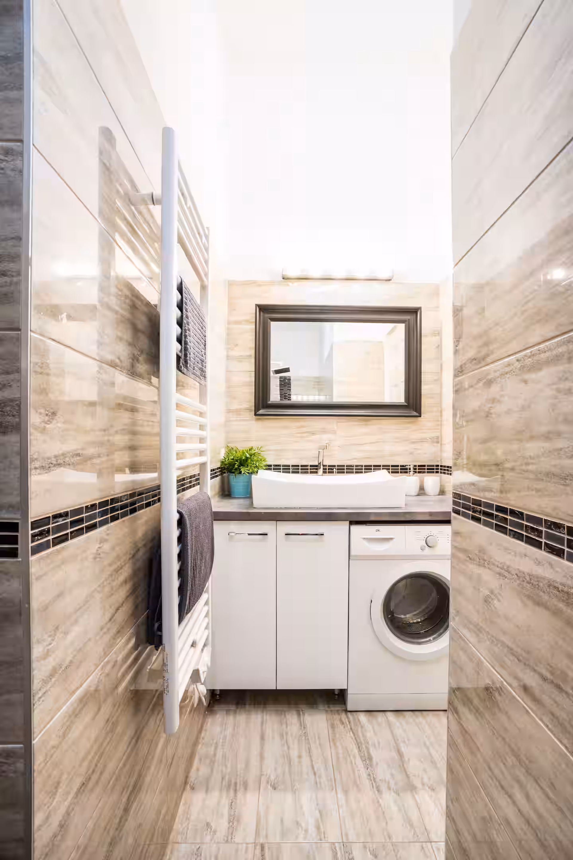 Bathroom with washer and sink