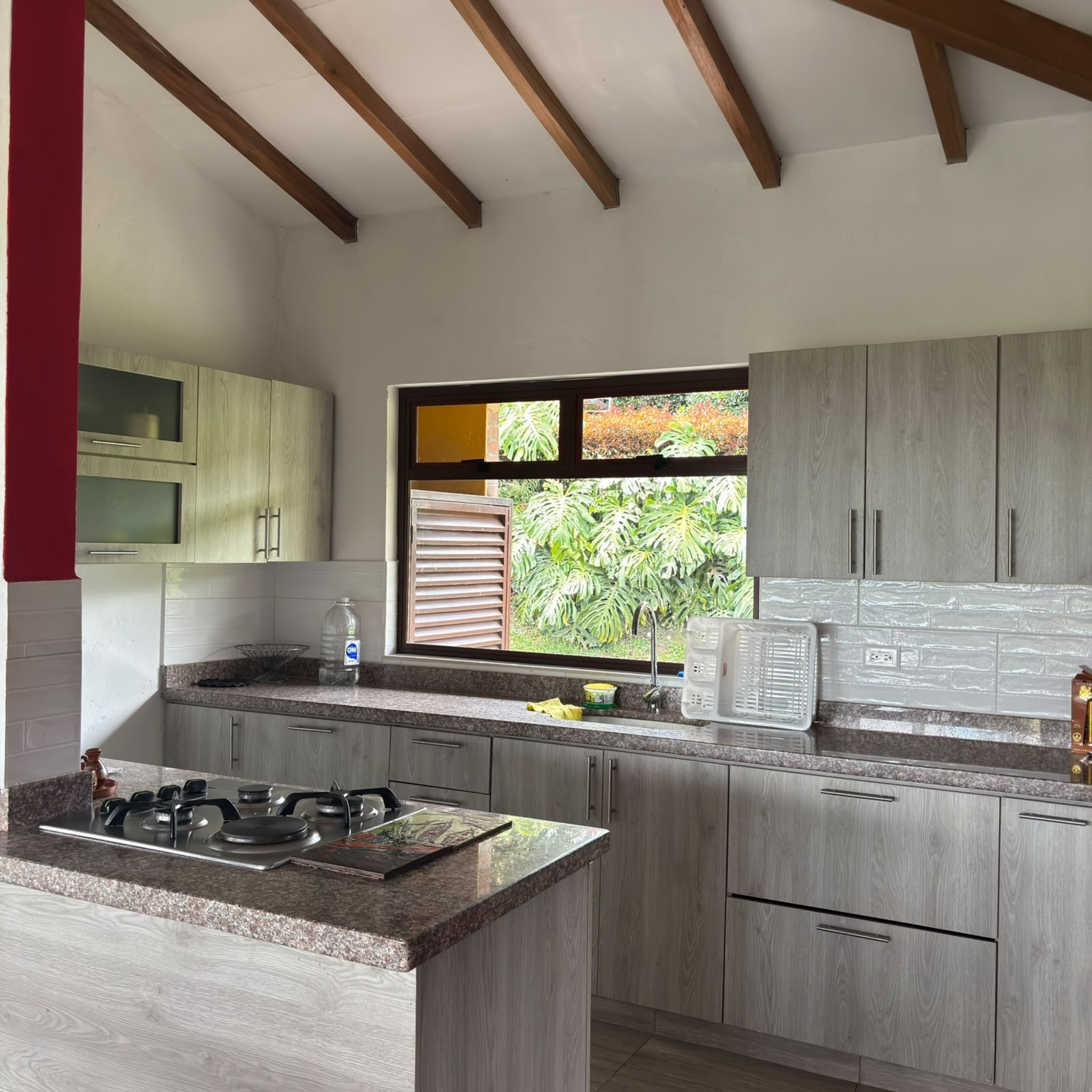 Kitchen with granite counters, garden window