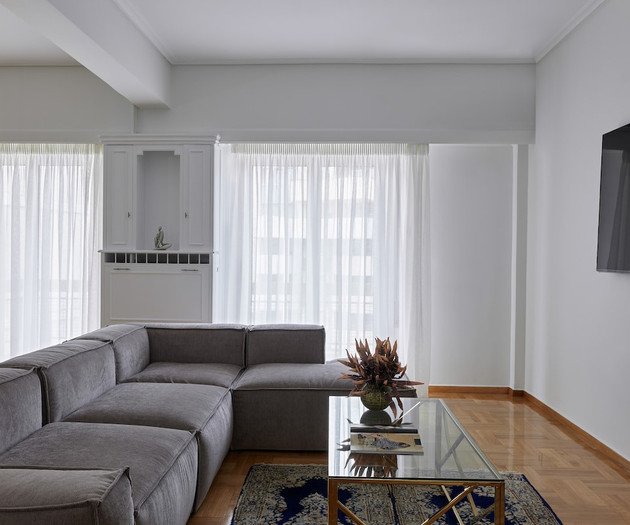 The spacious living room with a smart TV