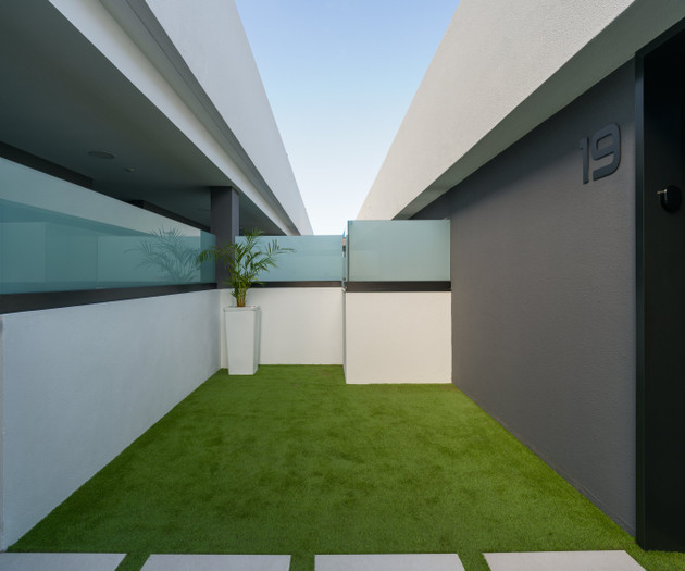 Private patio with artificial grass