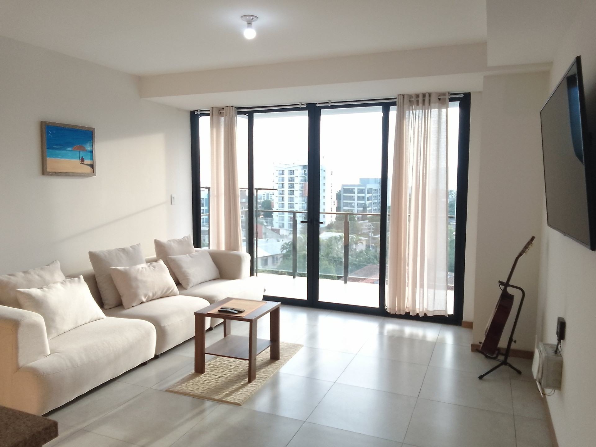 Bright living room with balcony view