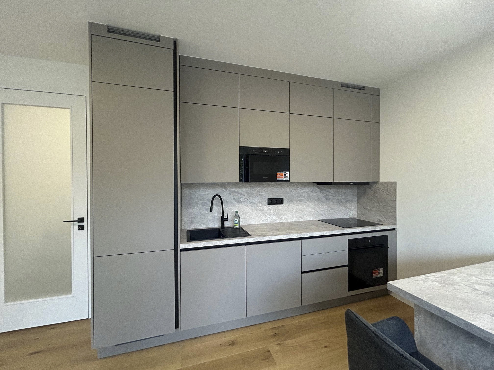 Modern grey kitchen with appliances