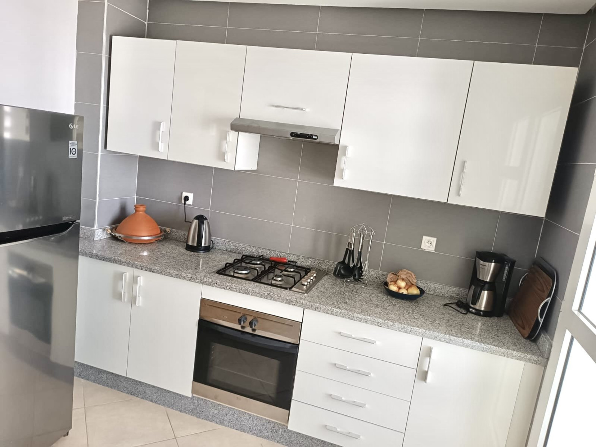 Modern white kitchen with appliances