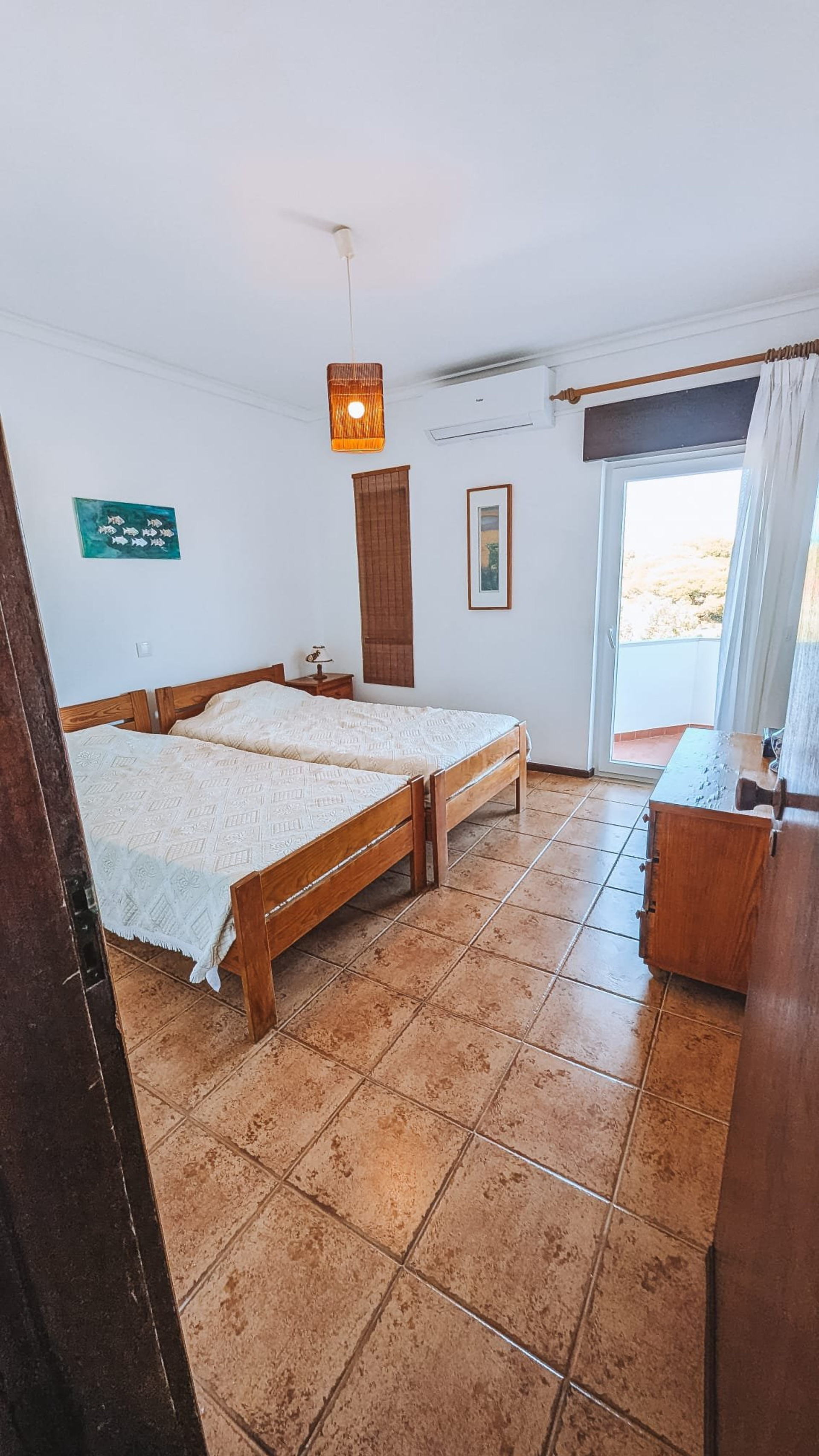Twin bedroom with balcony access