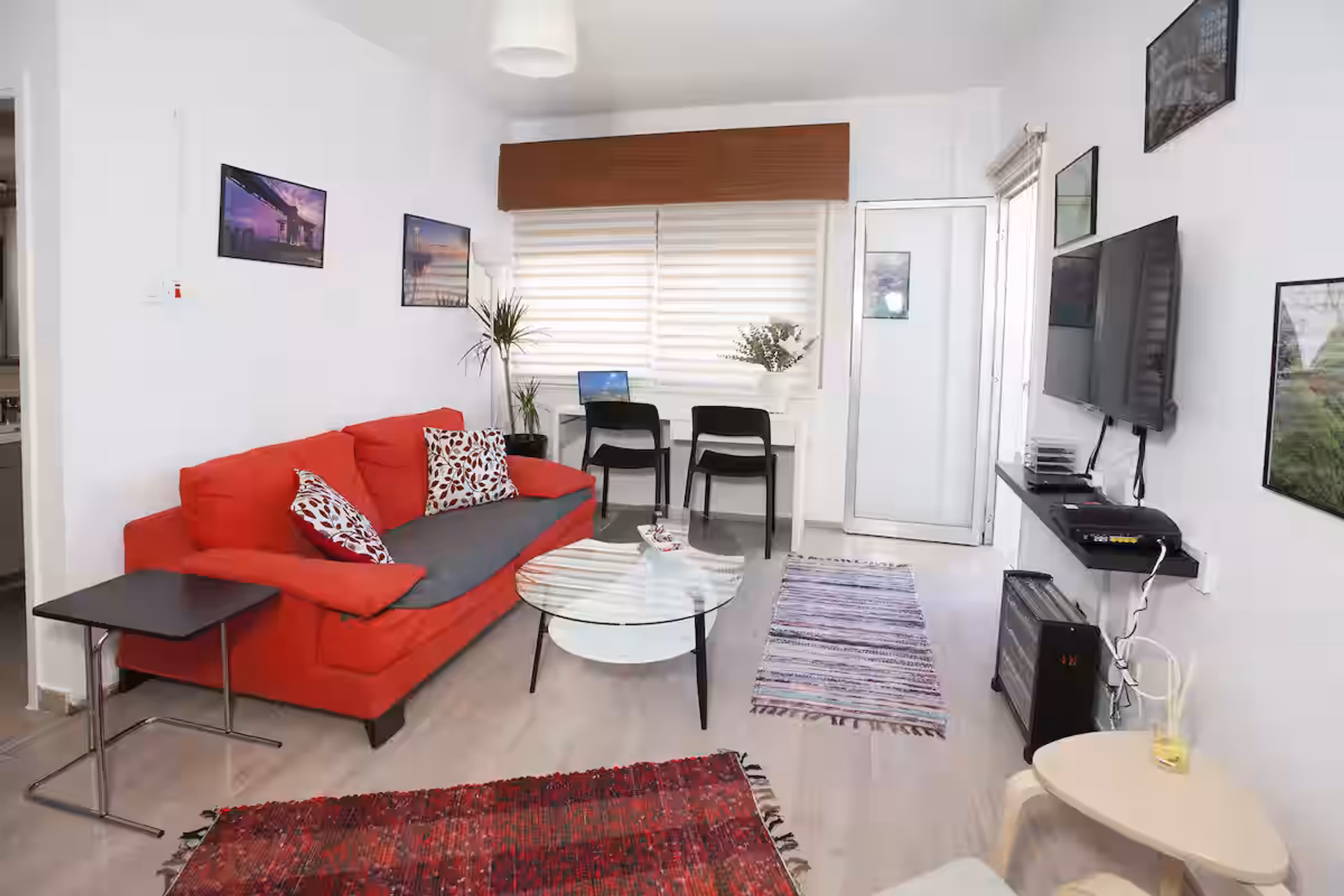 Bright living room with red sofa