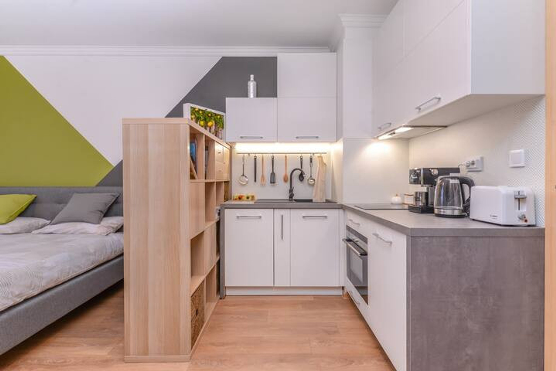 Fully equipped kitchen, complete with a combined microwave and traditional oven, dishwasher, extracting hood, toaster, and a premium coffee machine.