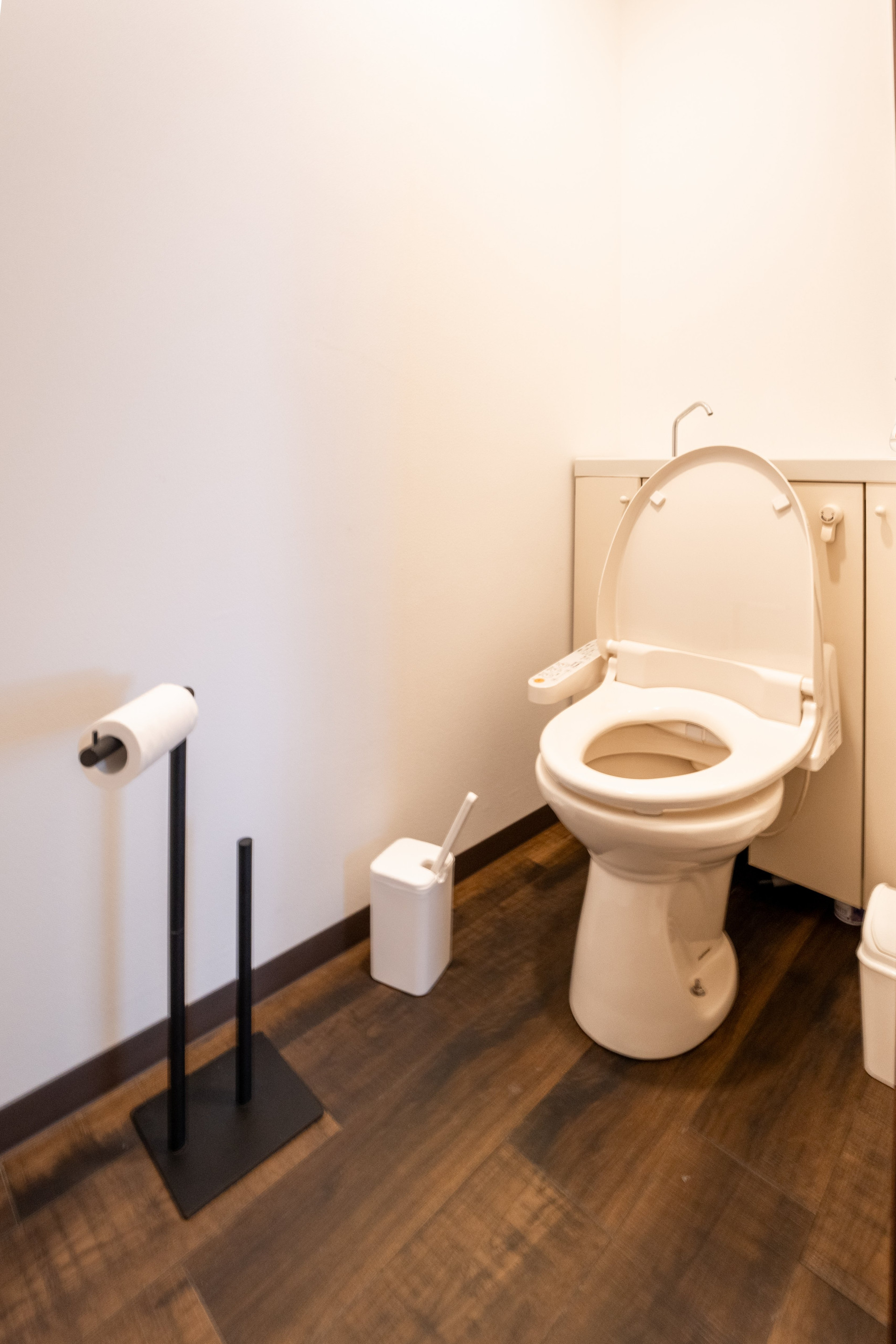 Toilet room with wood floor