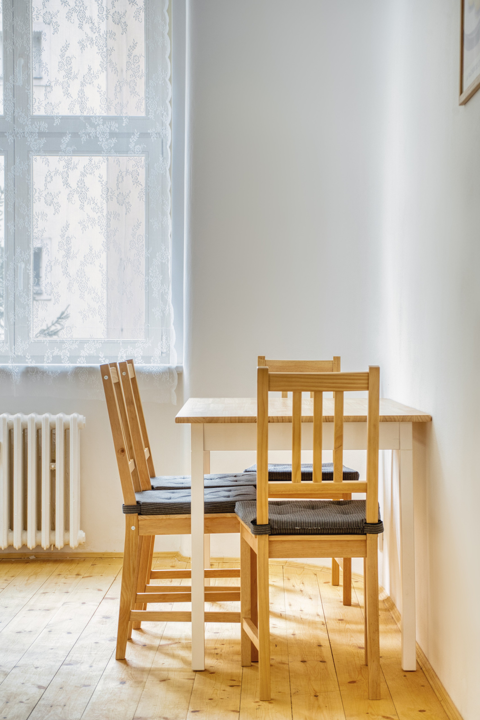 Dining nook with wooden chairs