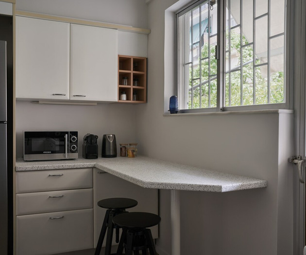 Kitchen space with a balcony at the back yard