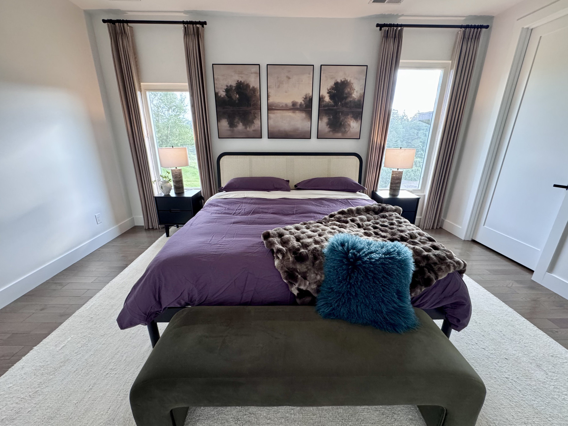 Purple-themed bedroom with art