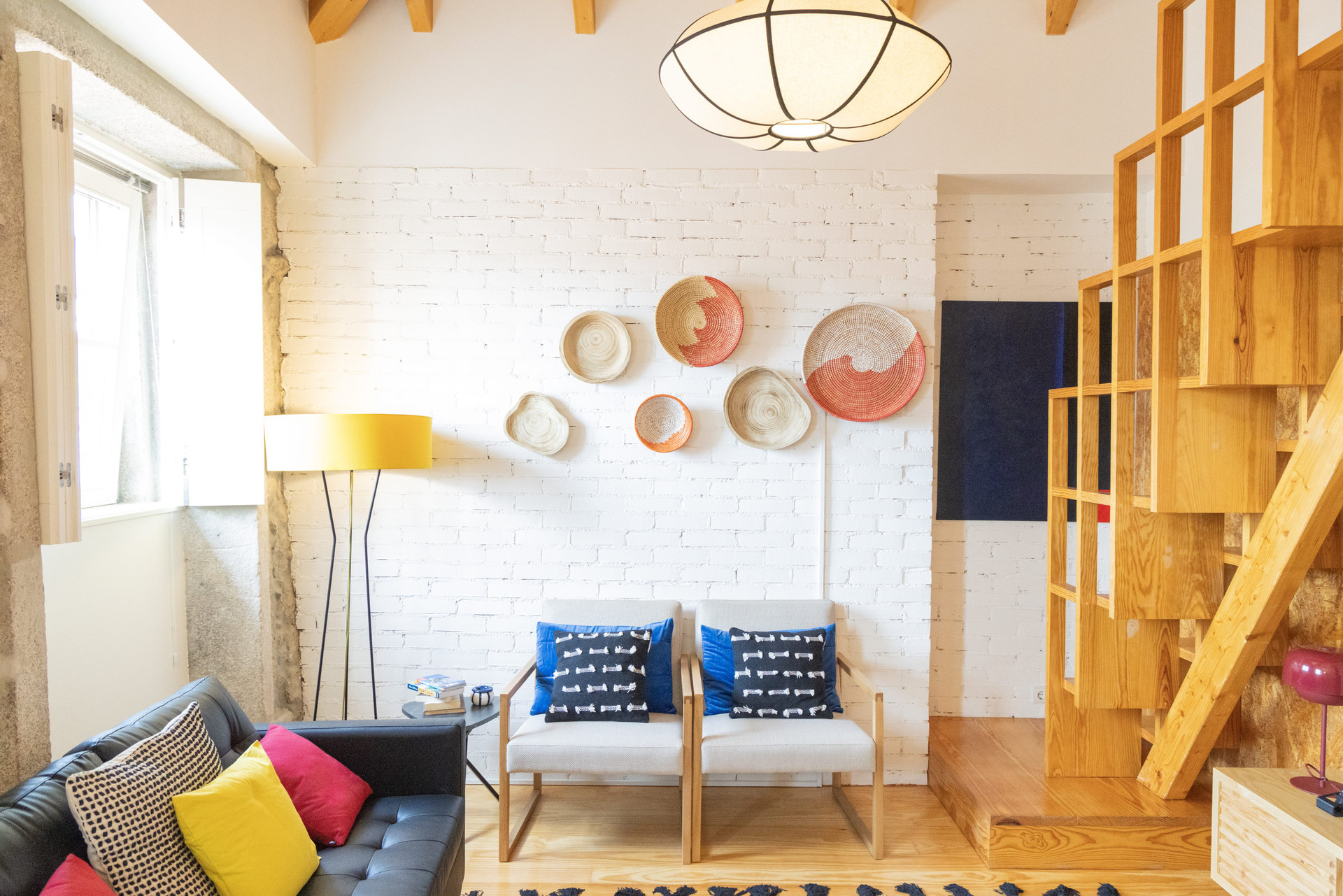 Living room seating with brick wall