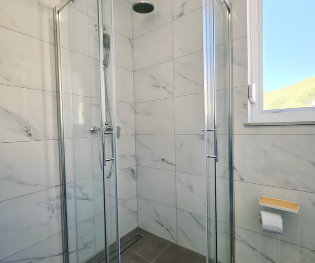 Glass shower enclosure