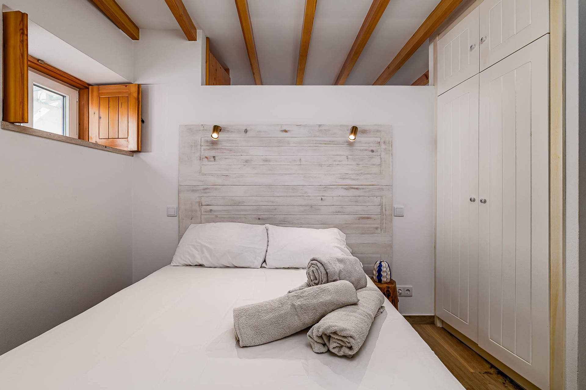 Bedroom with wardrobe and window