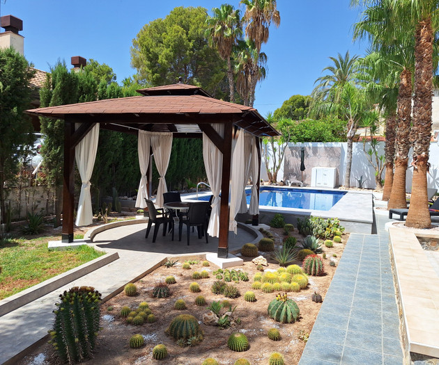 Gazebo and pool with cacti