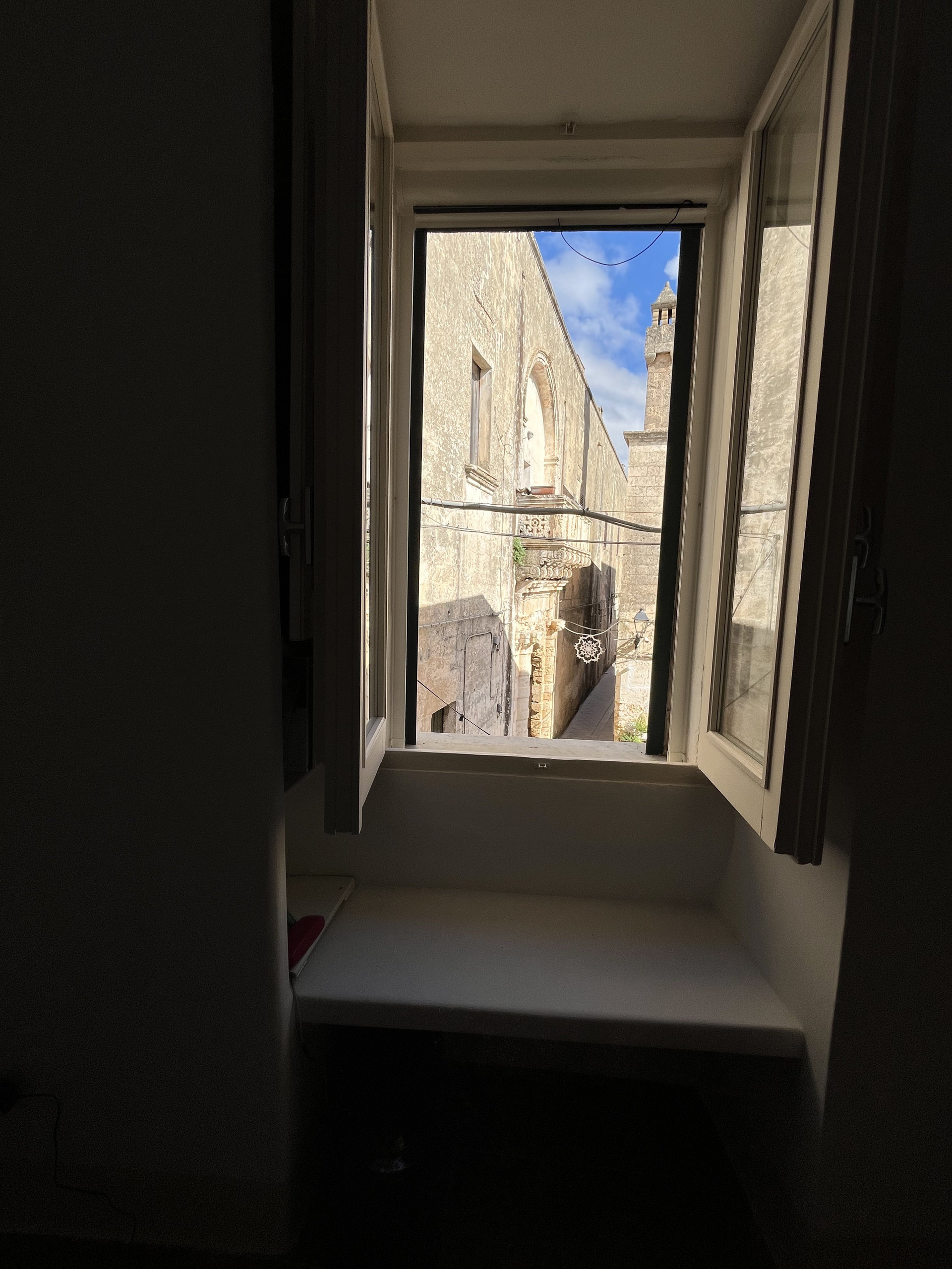Window nook overlooking historic street