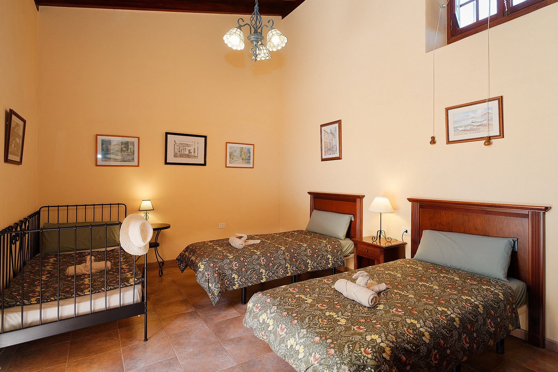 Bedroom with three beds