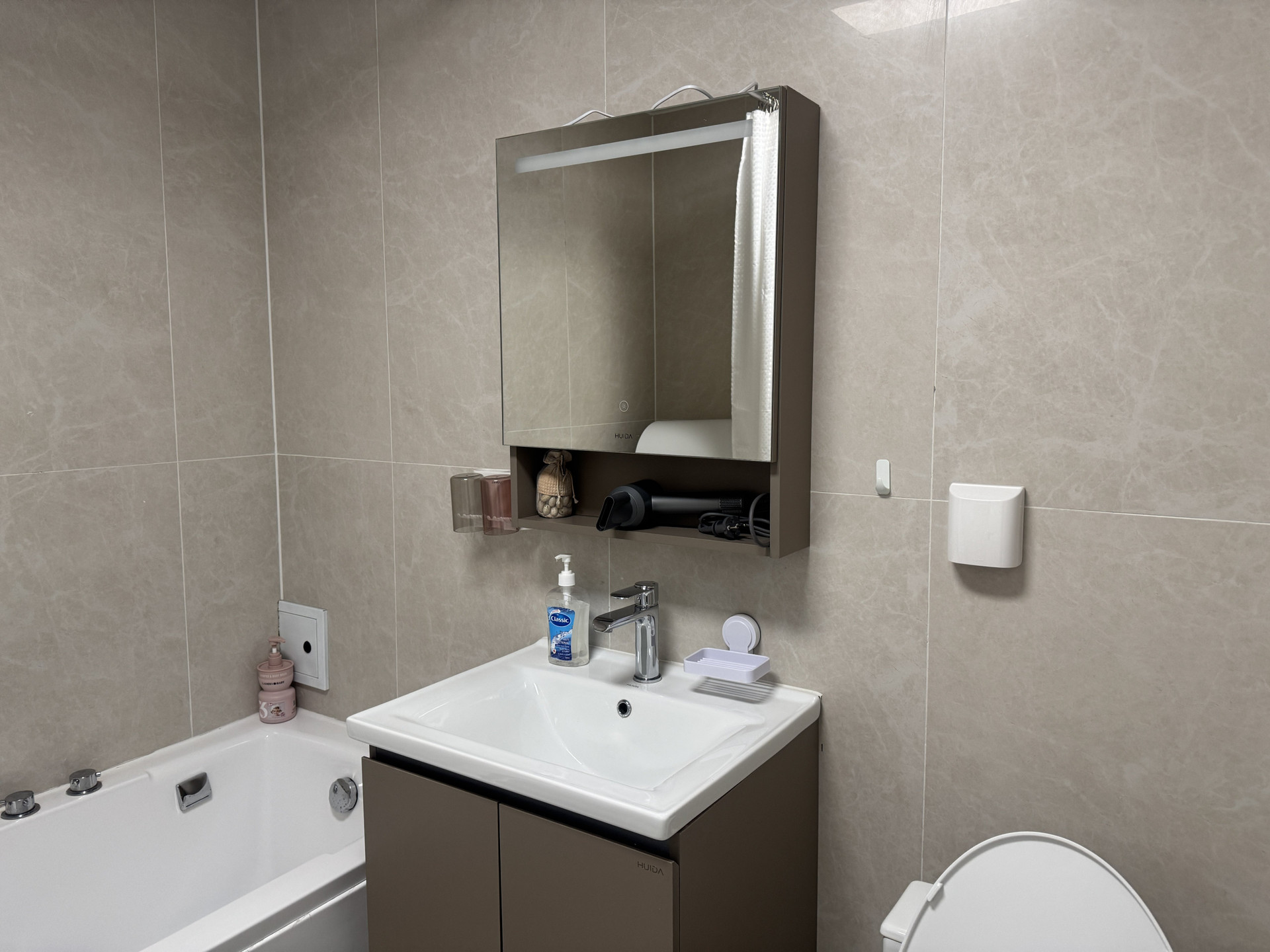 Bathroom with vanity and tub