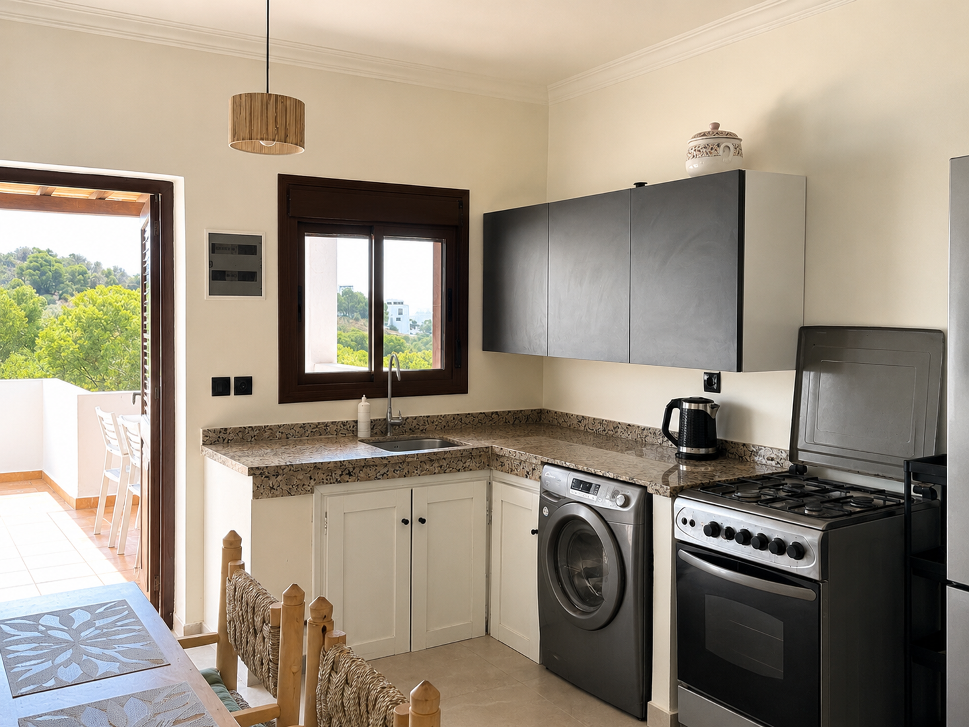 Kitchen with washer and stove