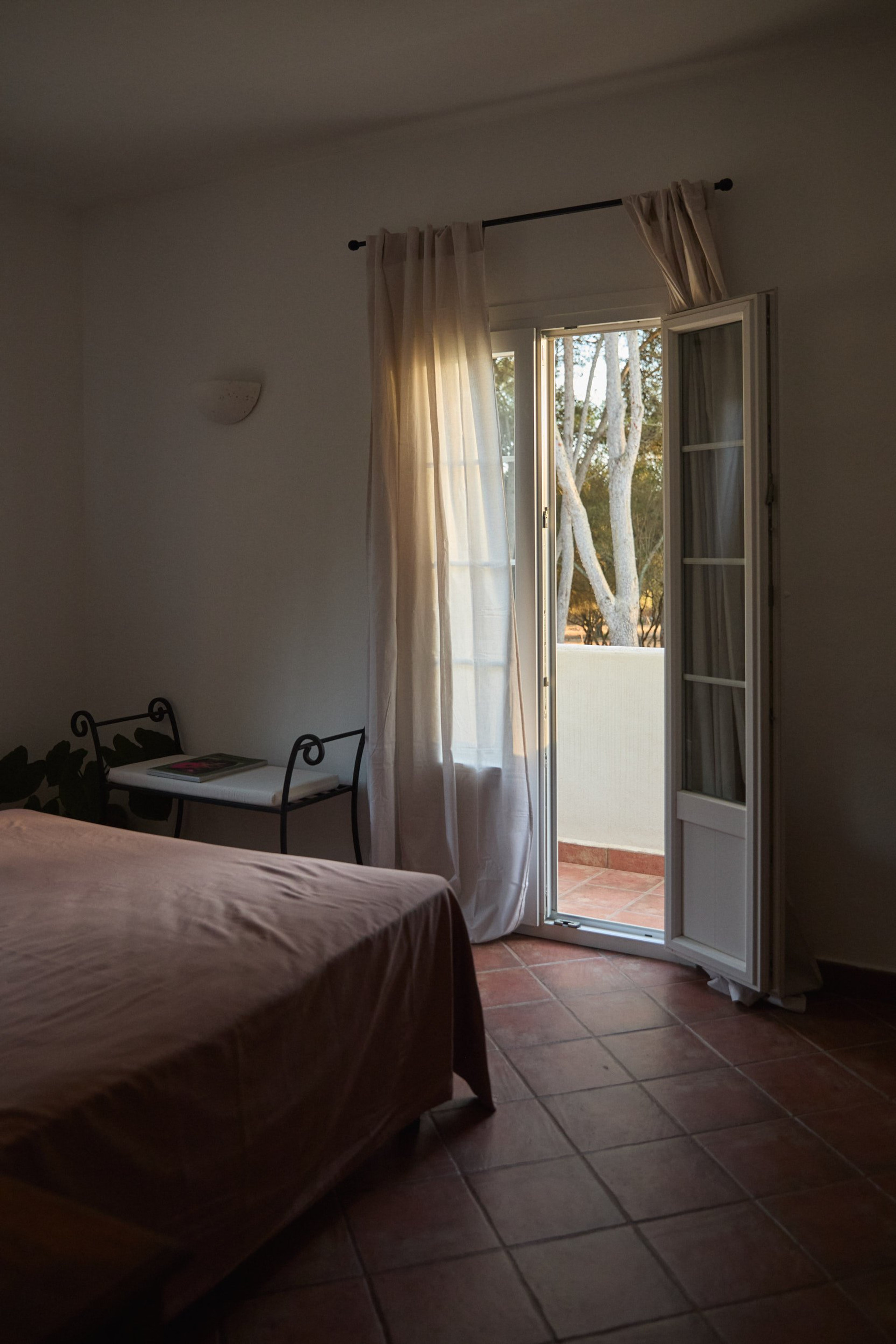Bedroom with balcony door open