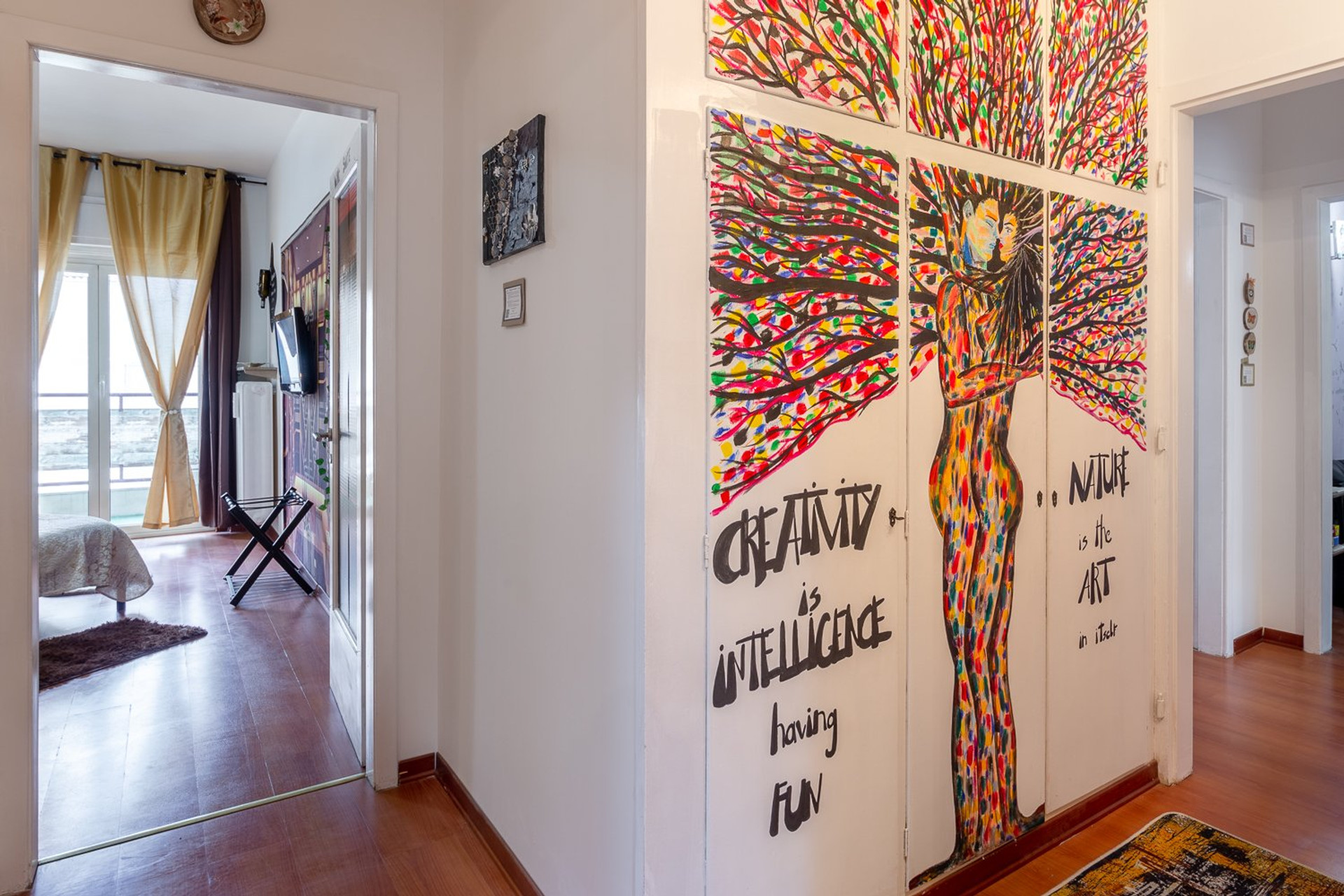 Colorful hallway with artwork mural