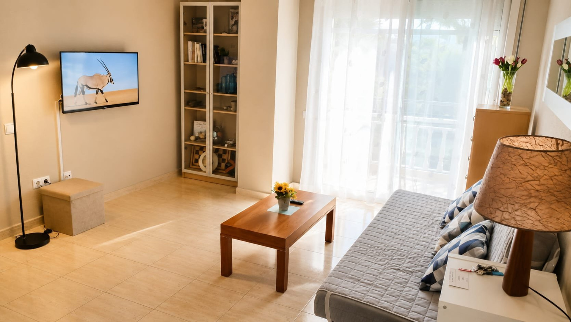 Living room with TV and balcony