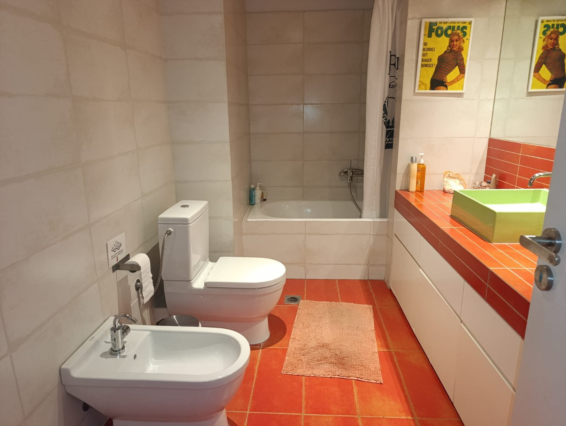 Bathroom with green sink