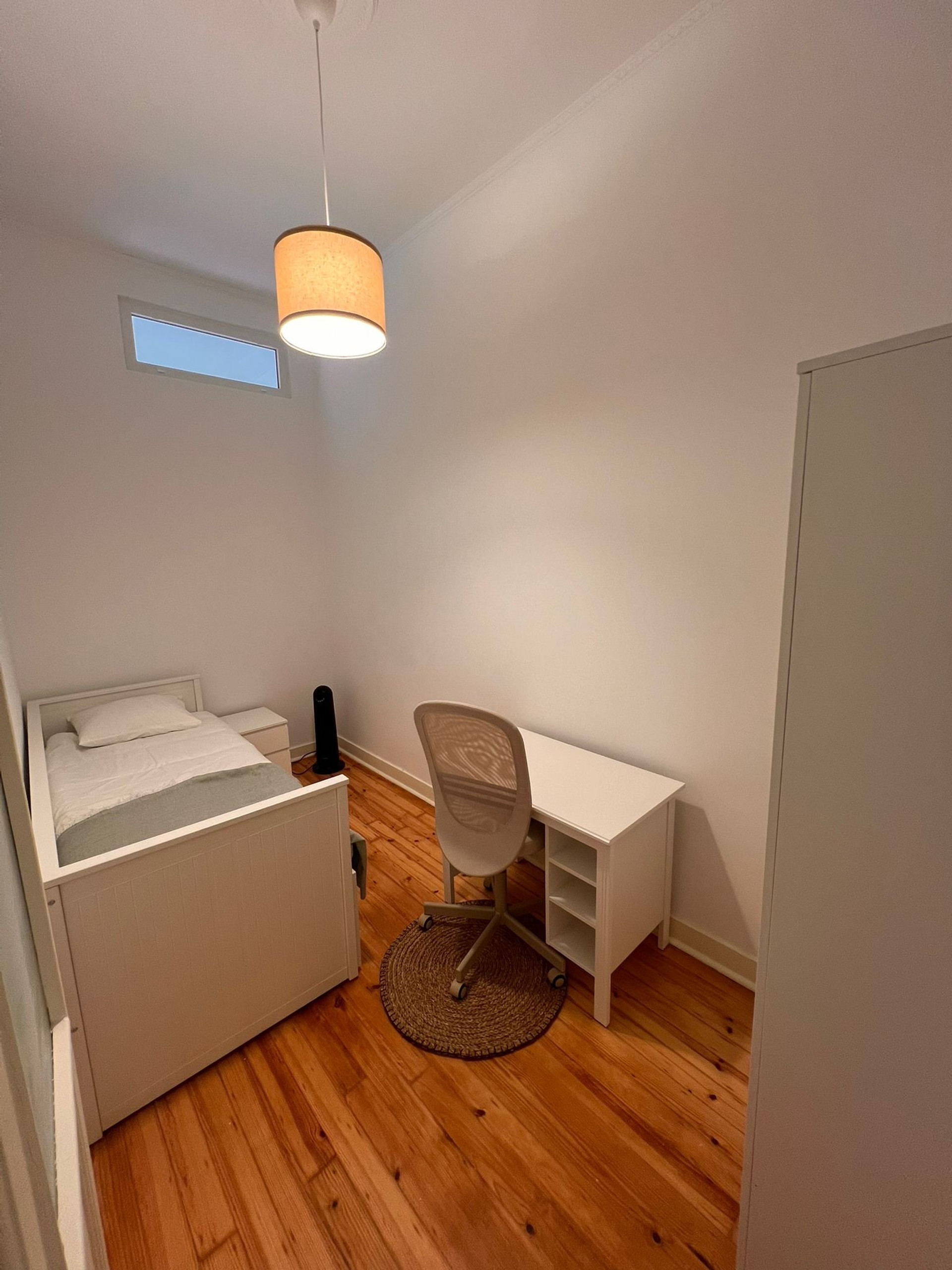 Bedroom with desk and wardrobe