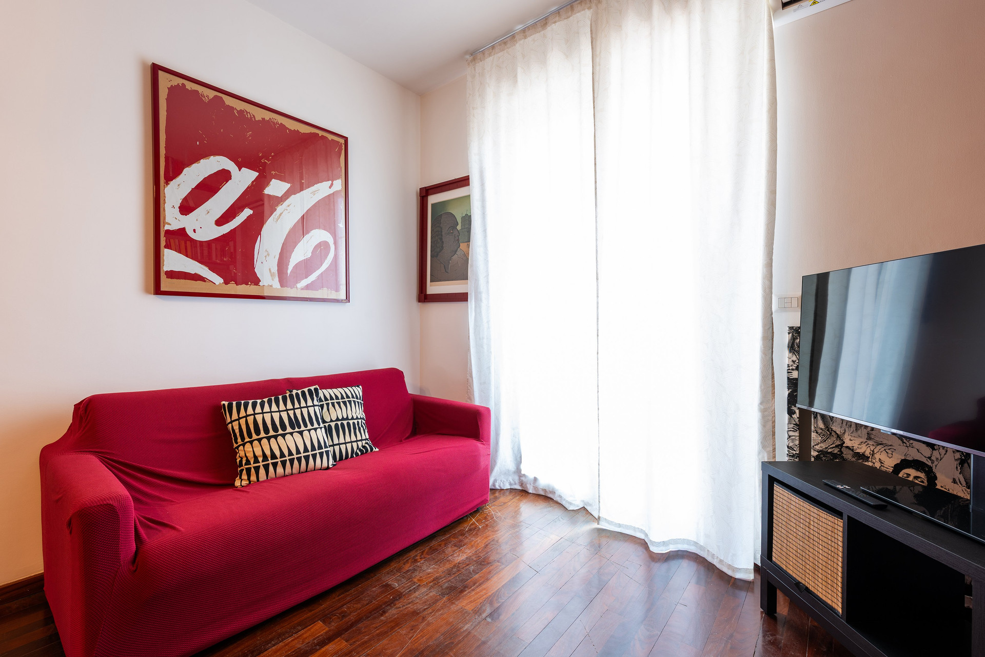 Red sofa and TV area