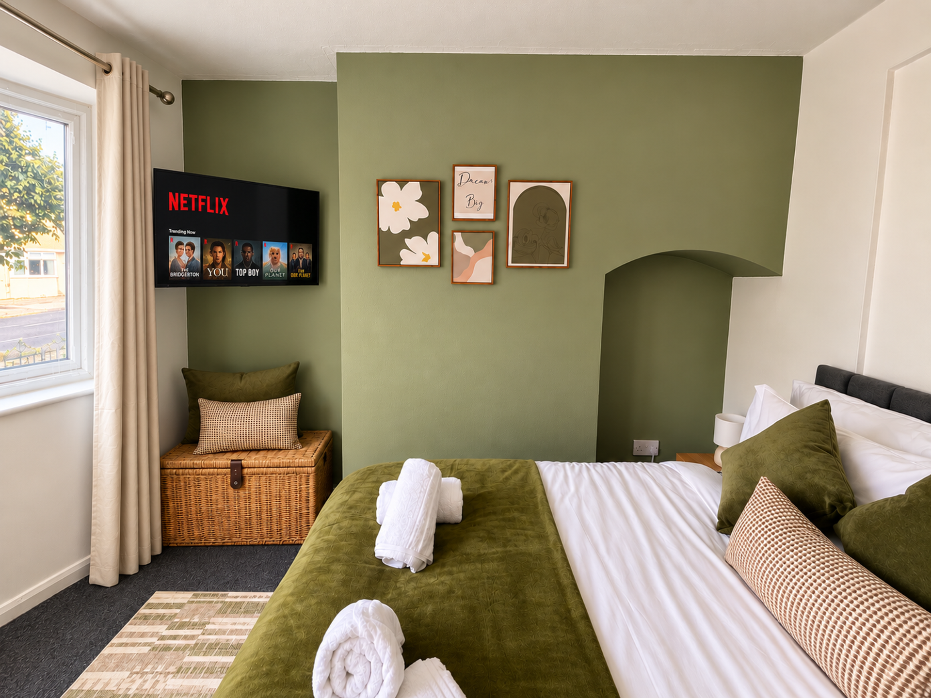 Green bedroom with Netflix TV