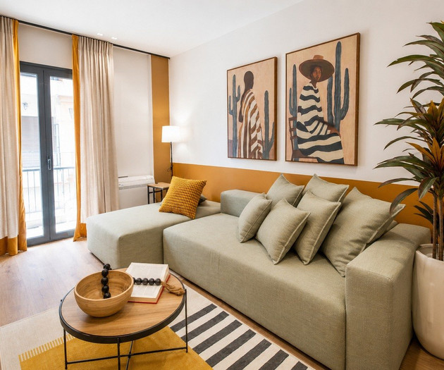 Living room with green sofa
