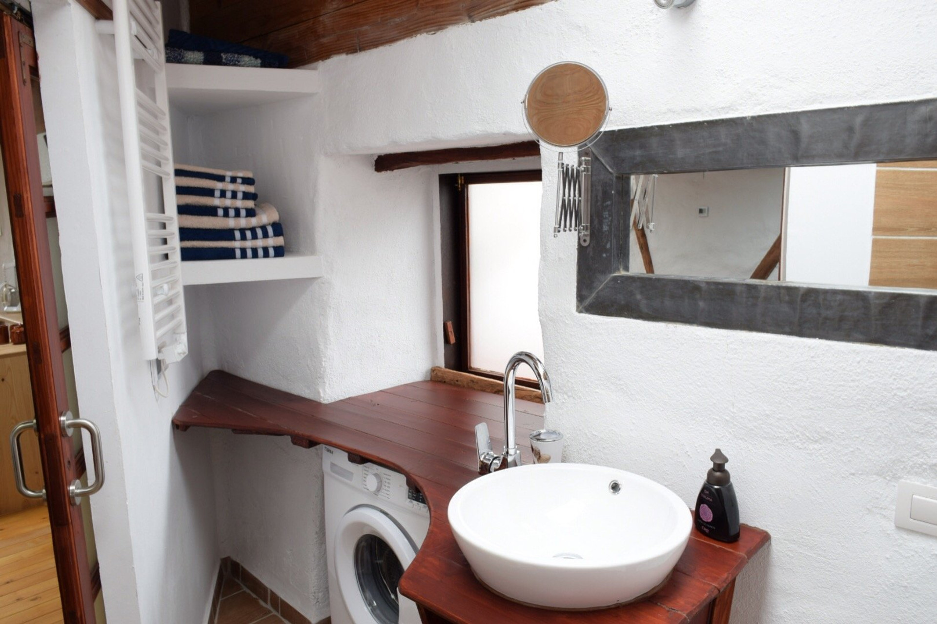 Bathroom with sink and washing machine