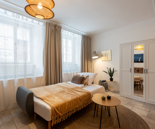 Bedroom with daybed and wardrobe