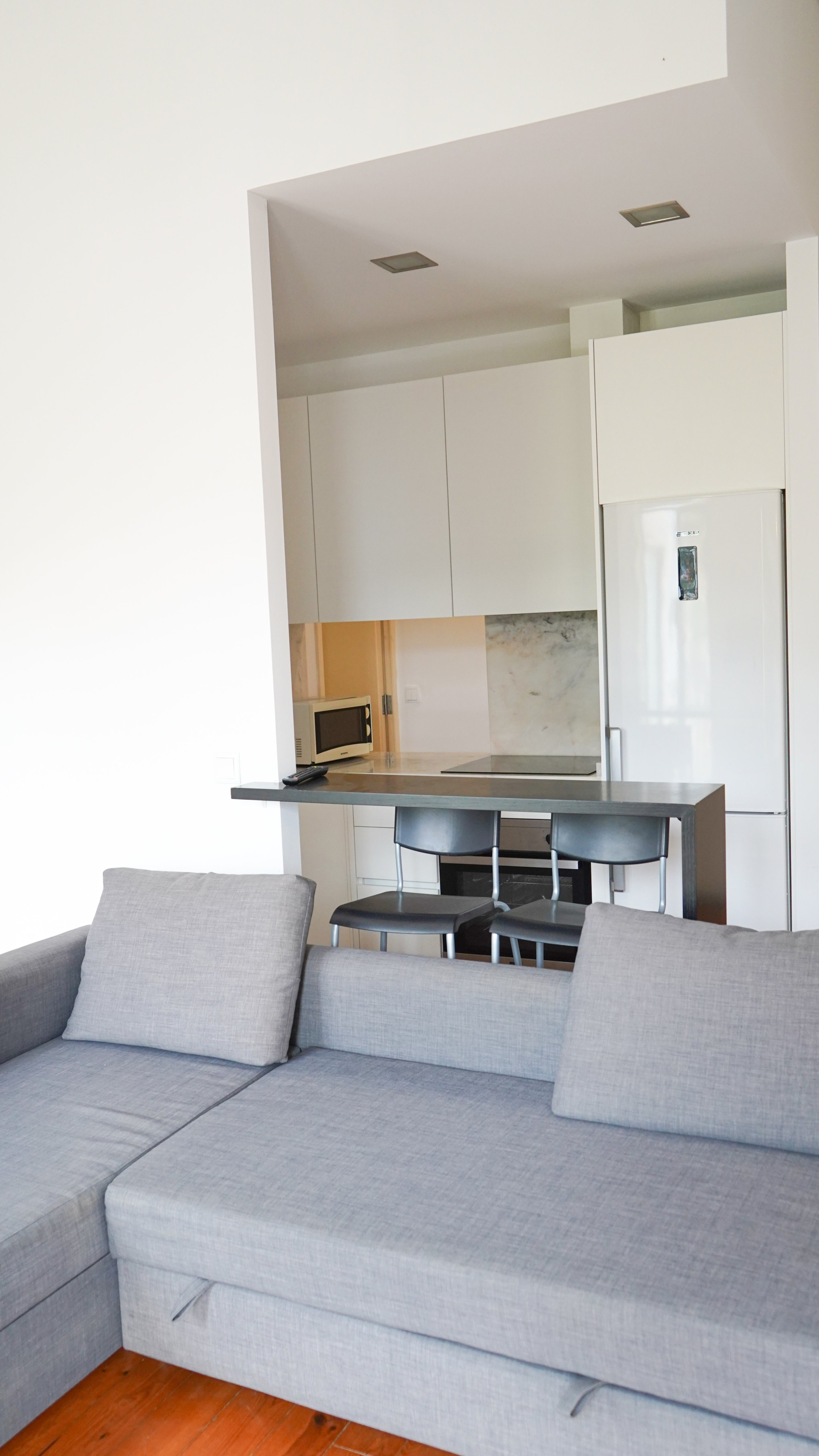 Living room sofa open kitchen view