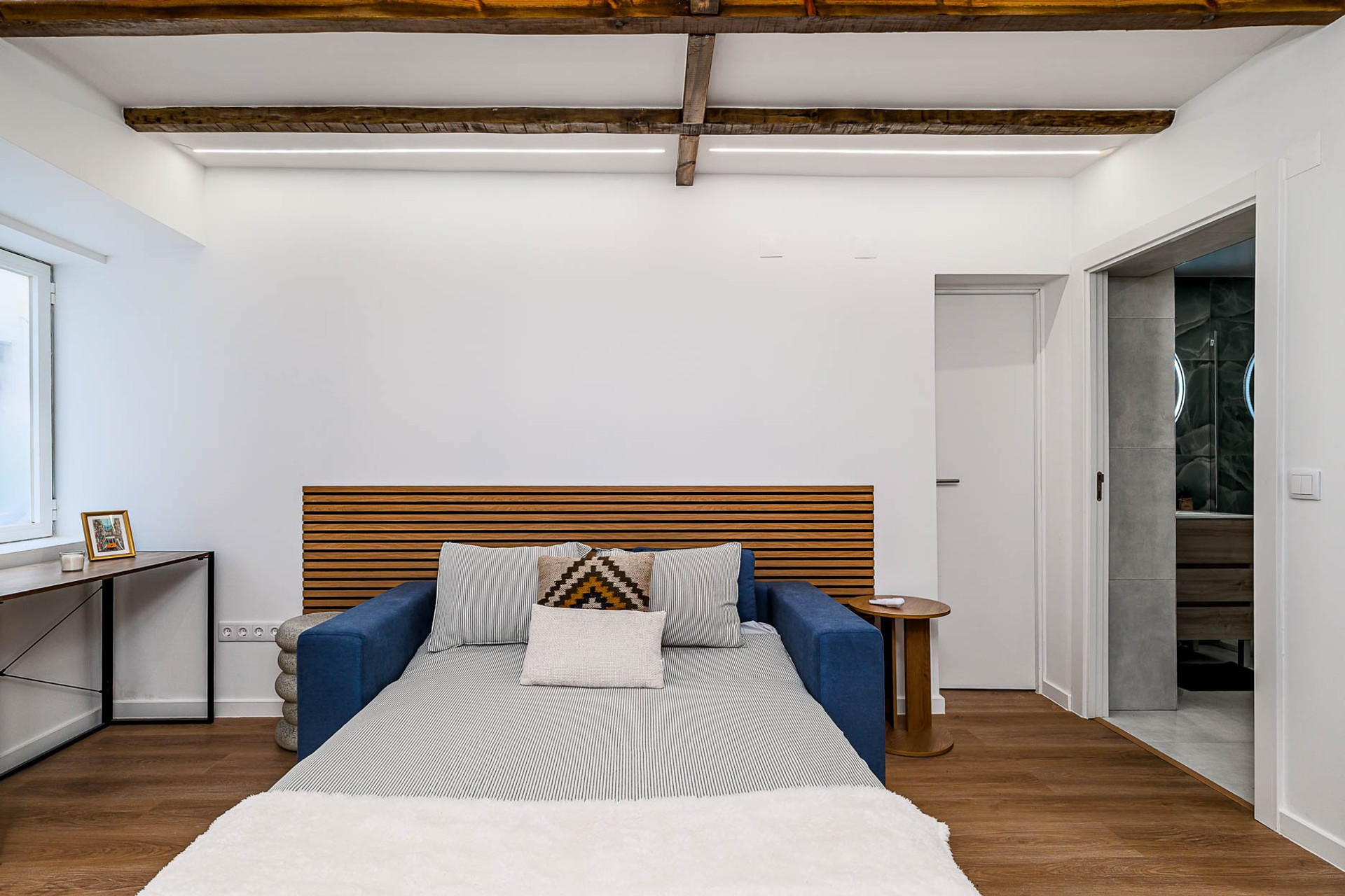 Living room with wood headboard beams