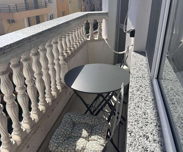 Balcony with table and chairs