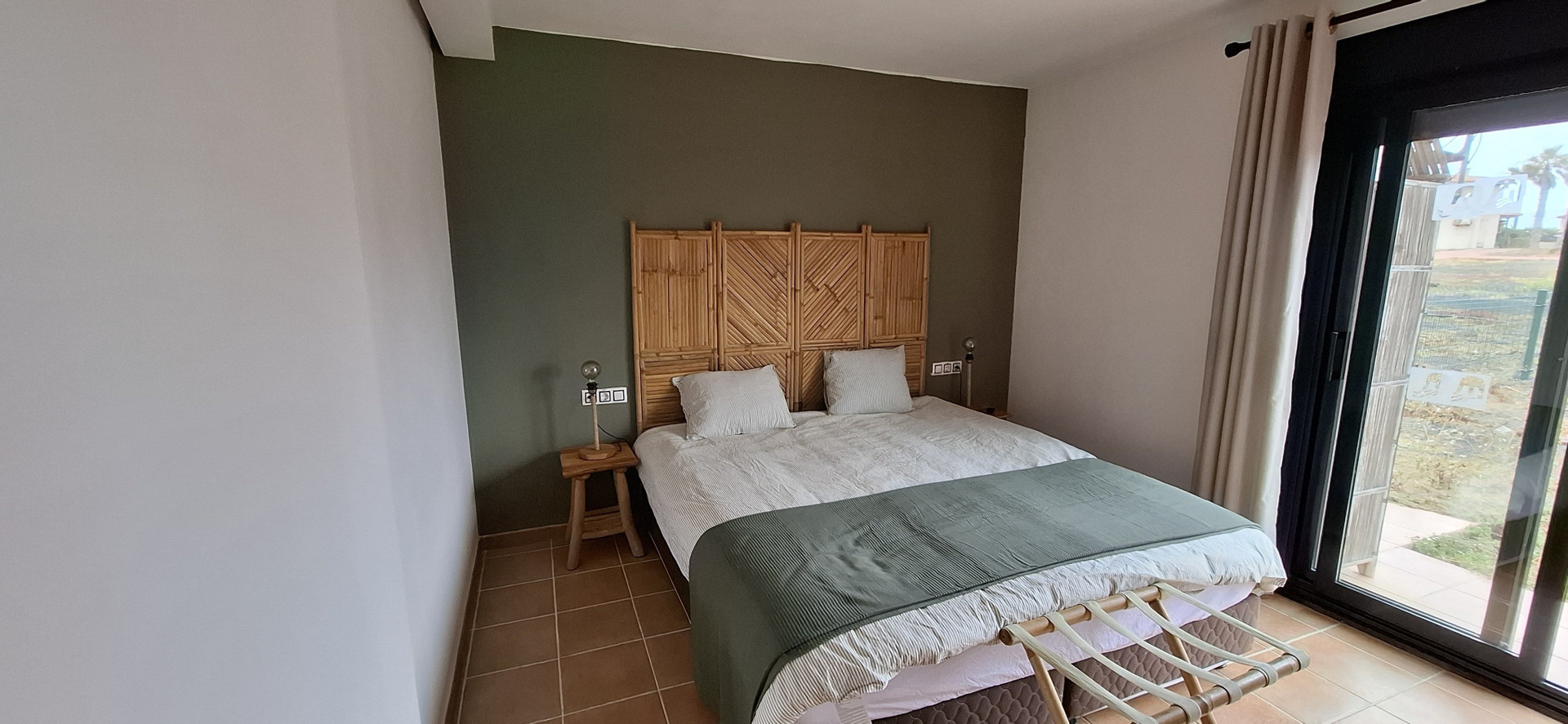 Bedroom with wooden headboard