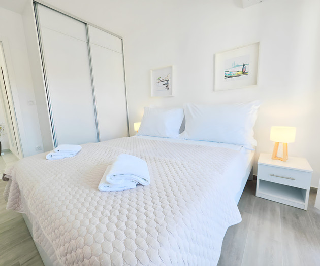 Bedroom with framed artwork