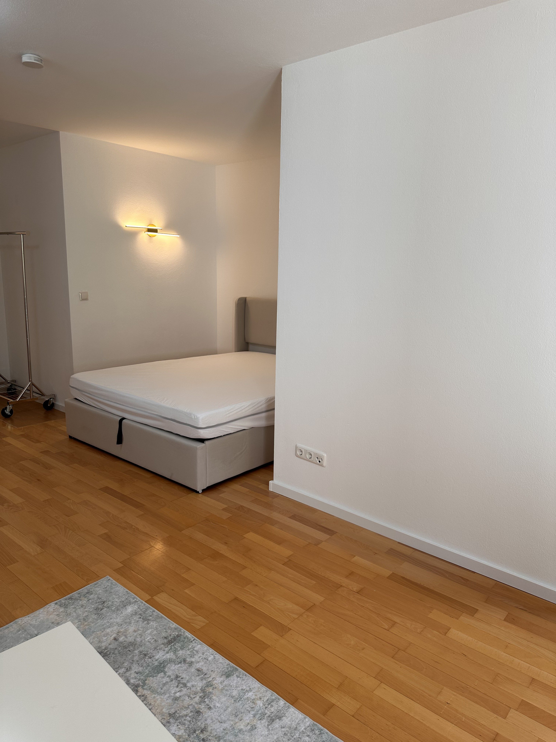Bed area with wall light