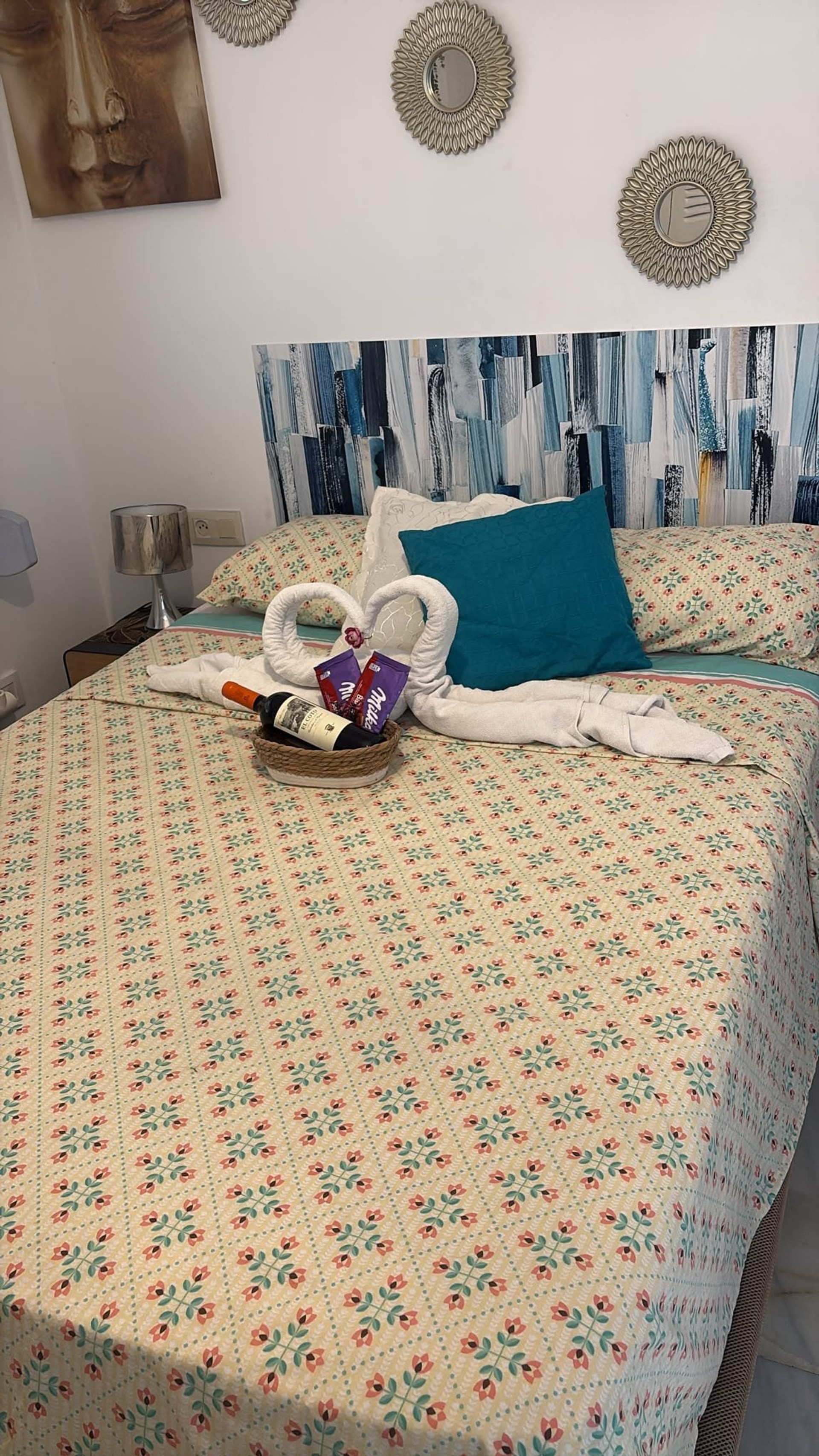Double bed with towel swans