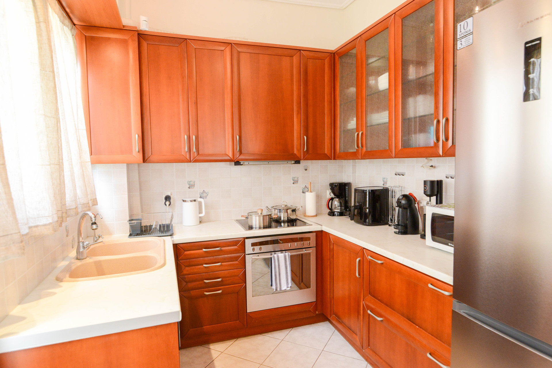 Kitchen with wooden cabinets and appliances