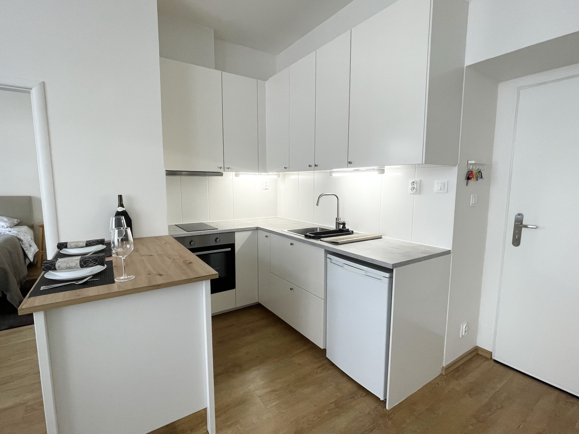 Modern white kitchen with bar