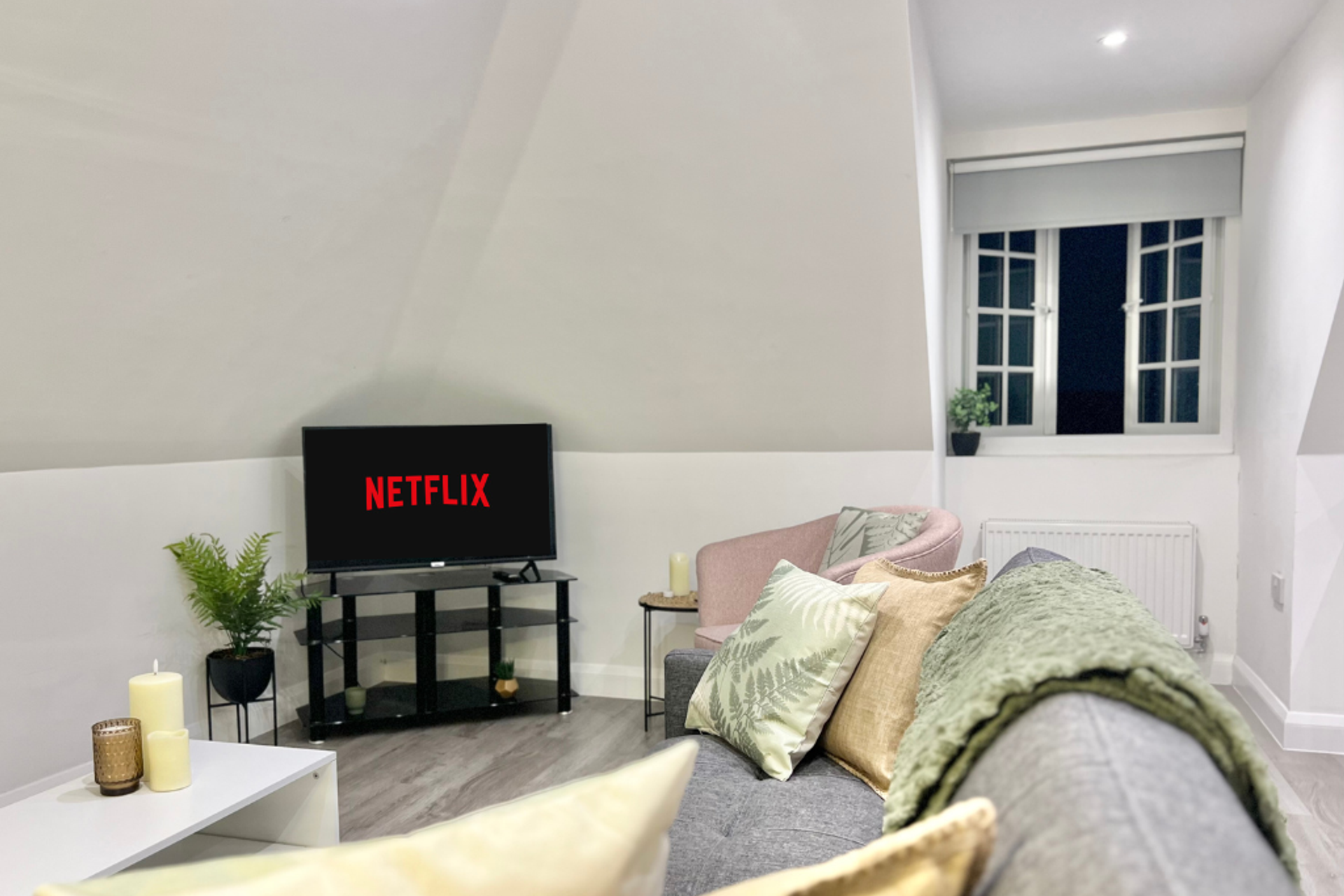 Living Area: Enjoy movie nights with Netflix and stylish seating in a bright, inviting space!
